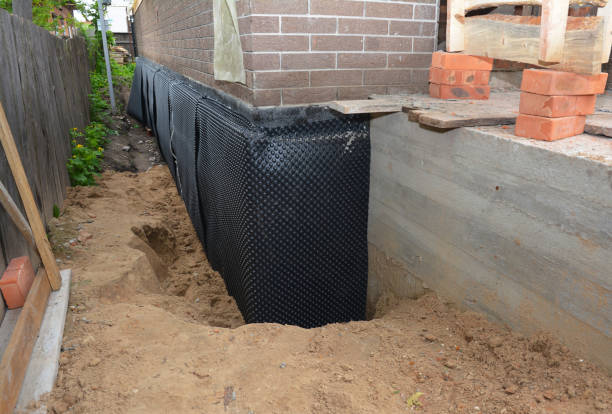 Happy homeowners after waterproofing job in Horton